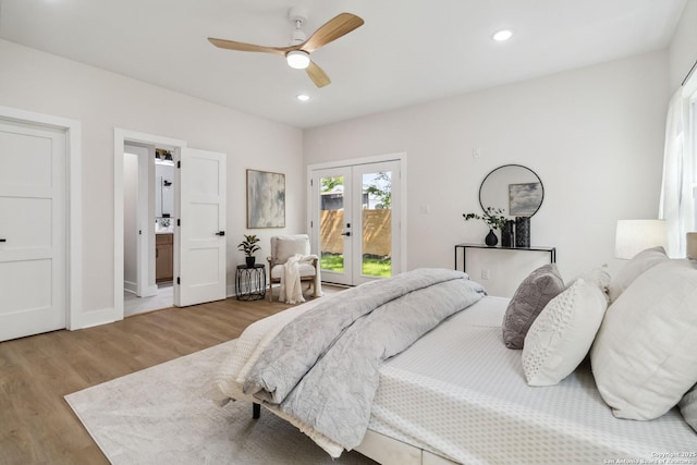 bedroom with recessed lighting, wood finished floors, a ceiling fan, french doors, and access to outside