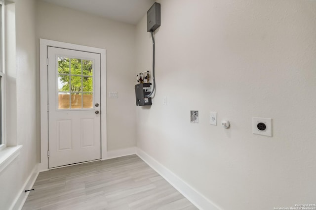 entryway featuring light wood-style flooring and baseboards