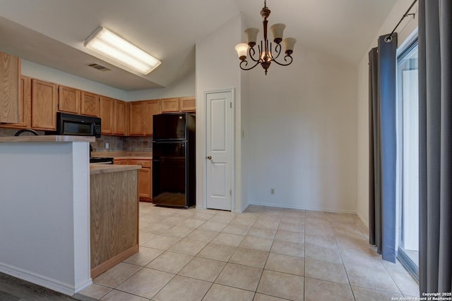 kitchen with vaulted ceiling, visible vents, backsplash, and black appliances