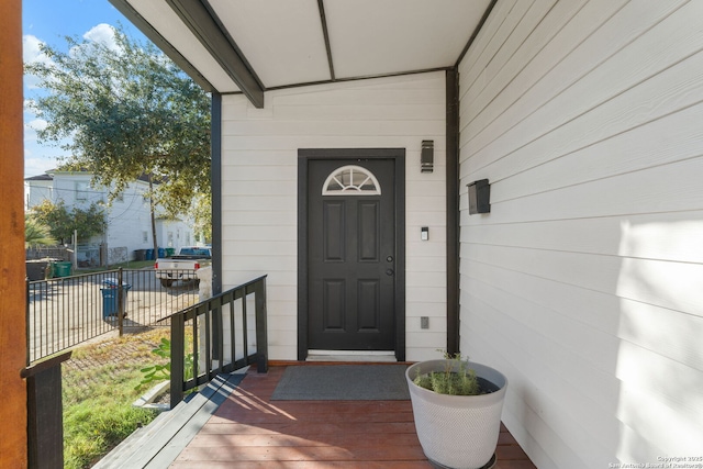 doorway to property with fence