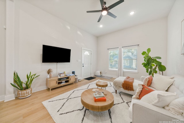 living room with light wood-style flooring, baseboards, recessed lighting, and ceiling fan