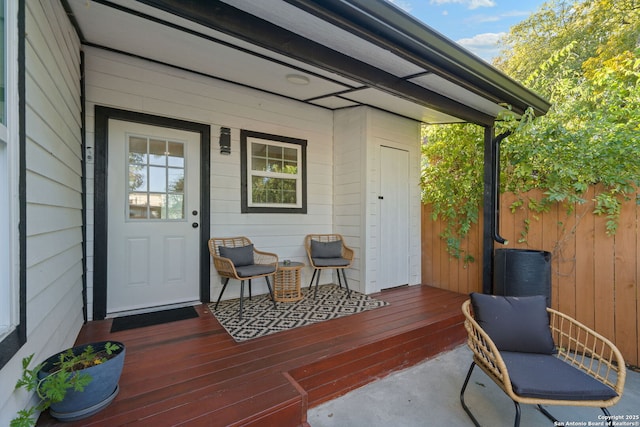 exterior space with covered porch and fence