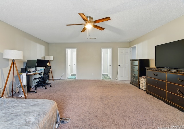 carpeted bedroom featuring baseboards, visible vents, and ceiling fan