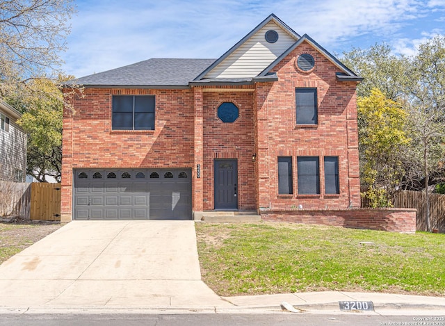 traditional home featuring fence, concrete driveway, a front yard, and a garage