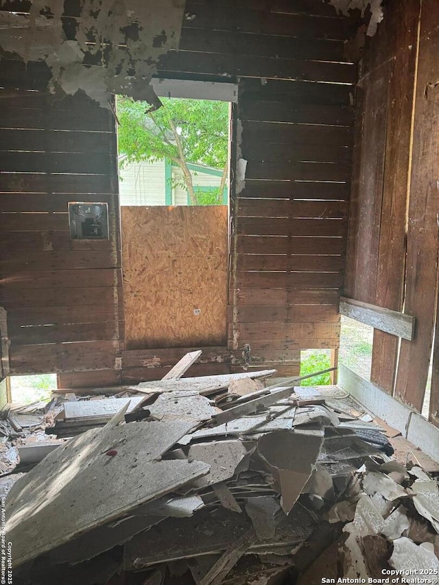 1130 Delaware, San Antonio, TX 78210 - empty room featuring wood walls and a healthy amount of sunlight