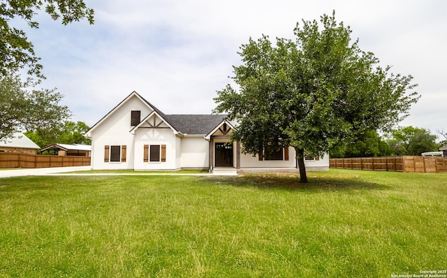 177 E Short Meadow Dr, Lytle, TX 78052 - modern inspired farmhouse featuring stucco siding, fence, and a front yard