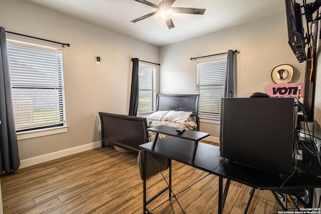 177 E Short Meadow Dr, Lytle, TX 78052 - office area with wood finished floors, ceiling fan, and a healthy amount of sunlight