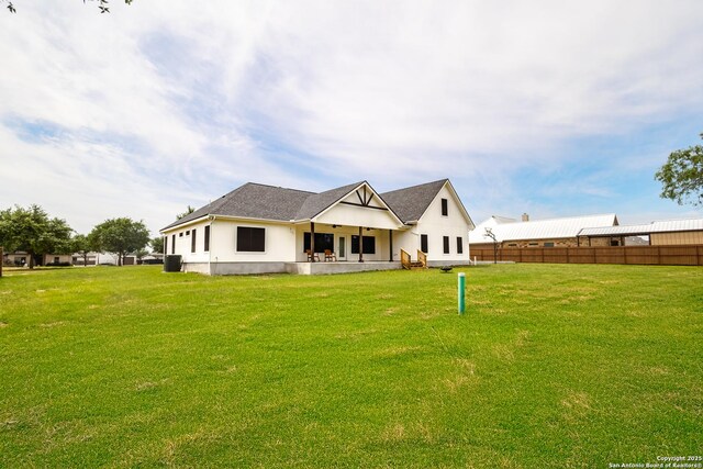 177 E Short Meadow Dr, Lytle, TX 78052 - rear view of property with fence and a yard