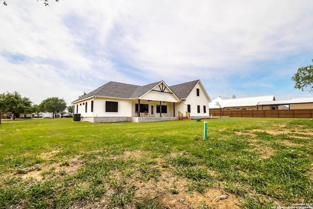 177 E Short Meadow Dr, Lytle, TX 78052 - back of property with a lawn and fence