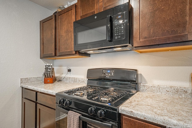 13907 Cyprus Sedge, San Antonio, TX 78254 - kitchen with black appliances, a textured wall, and light countertops