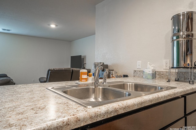 13907 Cyprus Sedge, San Antonio, TX 78254 - kitchen with open floor plan, a sink, visible vents, and light countertops