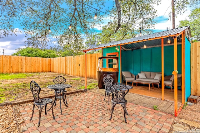 view of patio featuring a fenced backyard and an outdoor living space