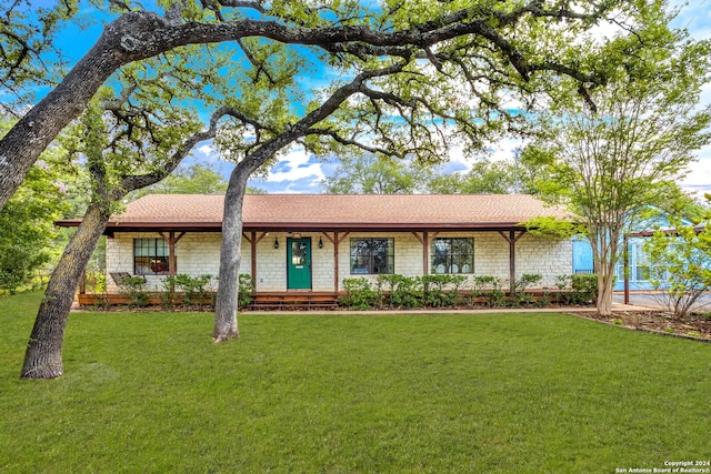 single story home with a front lawn and roof with shingles