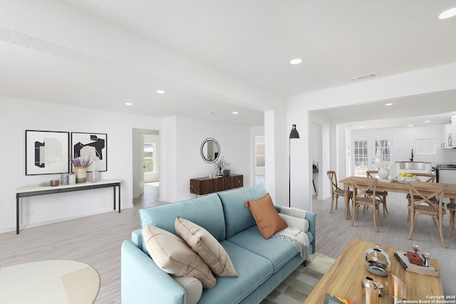 634 Venice, San Antonio, TX 78201 - living room with a wealth of natural light, light wood-style flooring, visible vents, and recessed lighting
