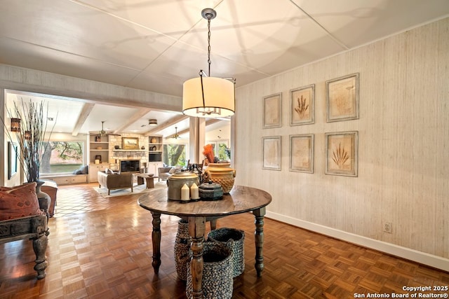 2802 State Highway 46, New Braunfels, TX 78132 - dining room featuring baseboards, a stone fireplace, and beam ceiling