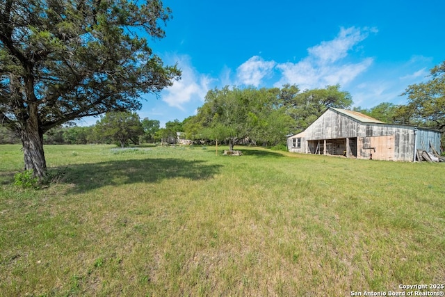 2802 State Highway 46, New Braunfels, TX 78132 - view of green lawn with a barn and an outdoor structure