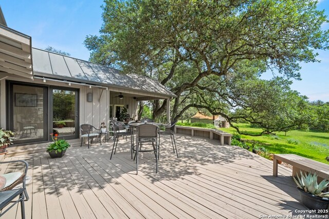 2802 State Highway 46, New Braunfels, TX 78132 - deck with a ceiling fan and outdoor dining area