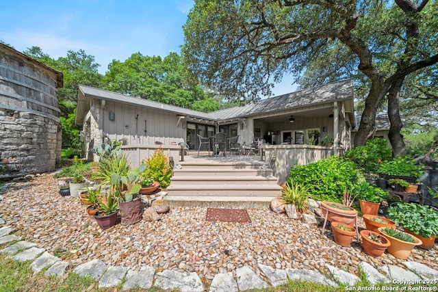 2802 State Highway 46, New Braunfels, TX 78132 - back of property featuring board and batten siding, a deck, and metal roof