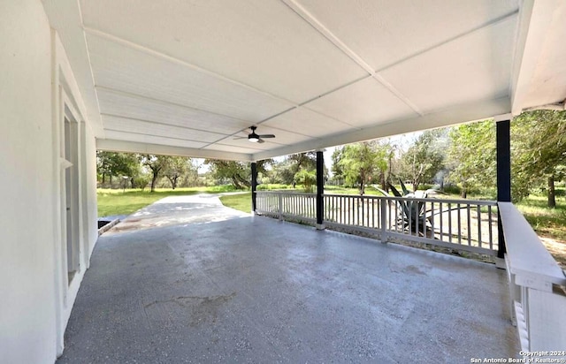 view of patio with a carport and ceiling fan