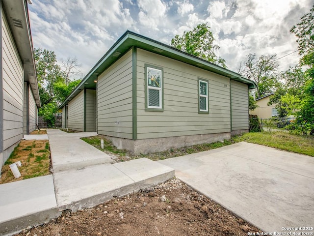 exterior space with fence and a patio area