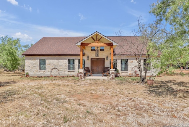 745 County Road 2645, Moore, TX 78057 - view of front facade with stone siding and a shingled roof