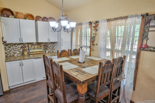 745 County Road 2645, Moore, TX 78057 - dining space featuring lofted ceiling, an inviting chandelier, and dark wood finished floors