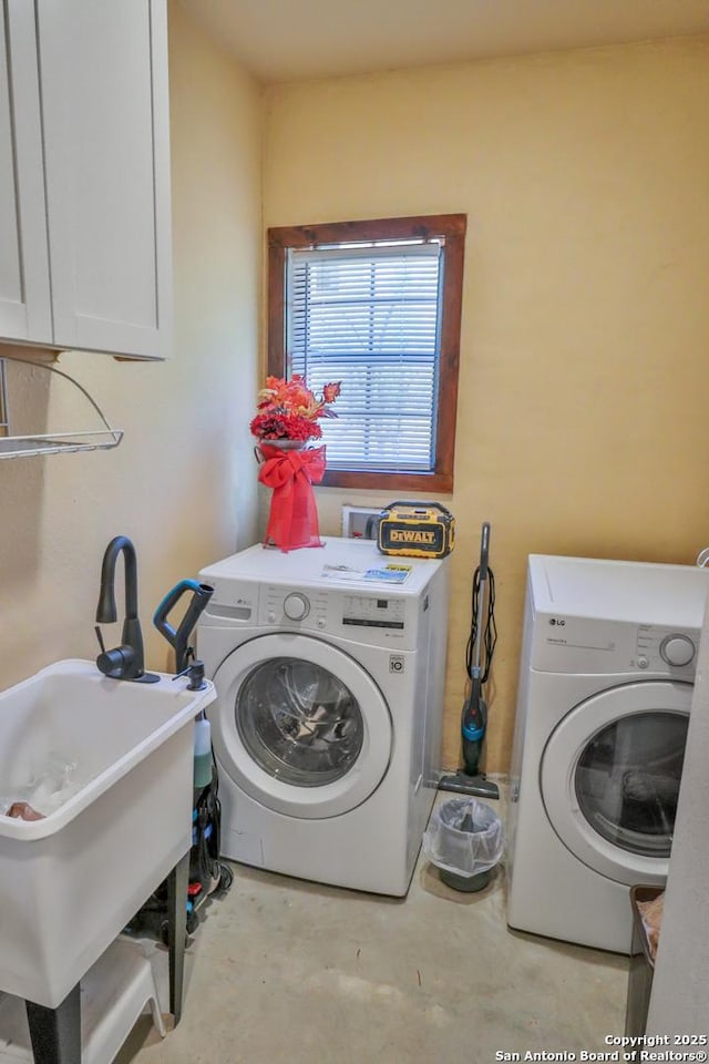 745 County Road 2645, Moore, TX 78057 - laundry room featuring cabinet space, a sink, and separate washer and dryer