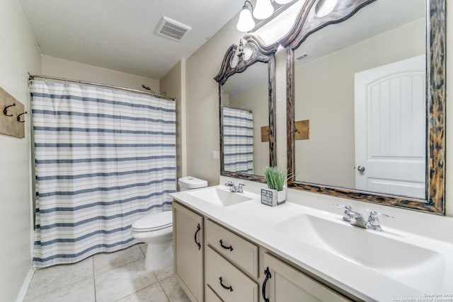 full bathroom featuring tile patterned flooring, visible vents, a sink, and toilet
