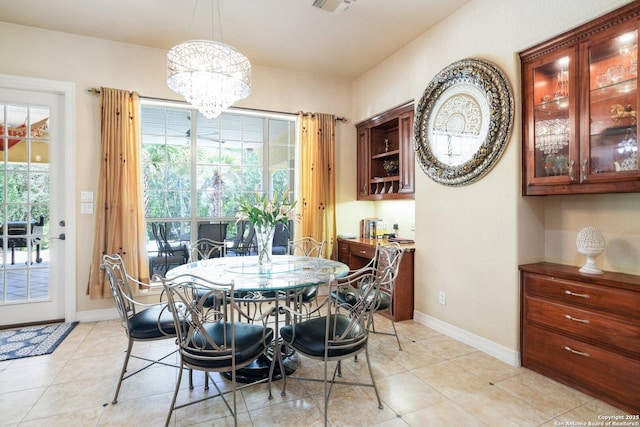 20646 Wahl, Garden Ridge, TX 78266 - dining space featuring a chandelier, baseboards, and light tile patterned floors