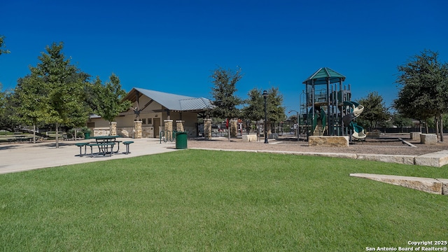 community jungle gym with a lawn