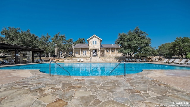 pool with a patio area