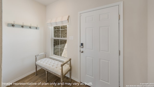 entryway featuring wood finished floors and baseboards