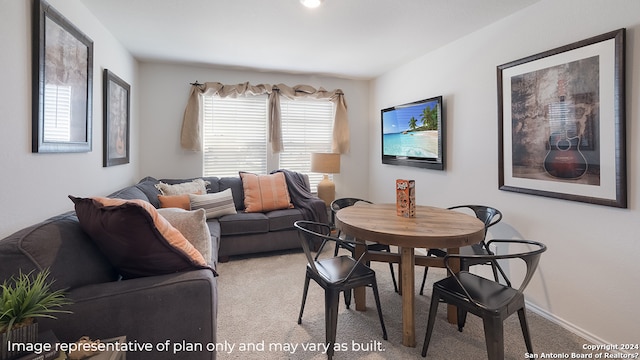 living room with light carpet and baseboards