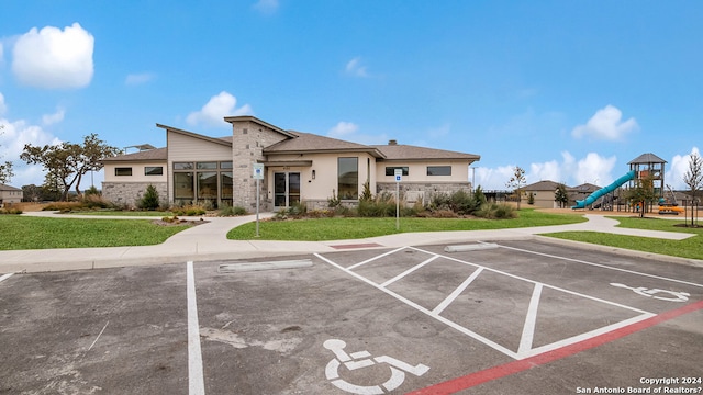 view of property featuring uncovered parking