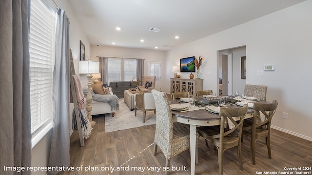 dining area with recessed lighting, wood finished floors, visible vents, and baseboards