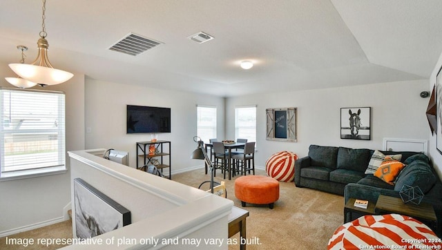 living room featuring visible vents, baseboards, and light colored carpet