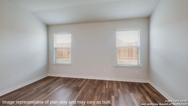 14614 Clay Ridge Run, San Antonio, TX 78253 - spare room with plenty of natural light, dark wood finished floors, and baseboards
