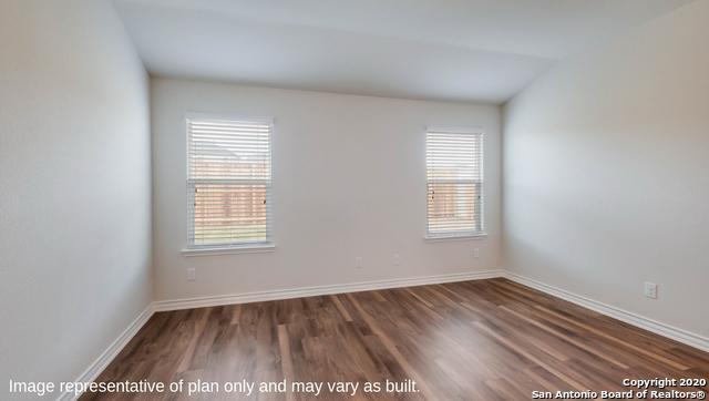 14614 Clay Ridge Run, San Antonio, TX 78253 - unfurnished room featuring plenty of natural light, dark wood finished floors, and baseboards