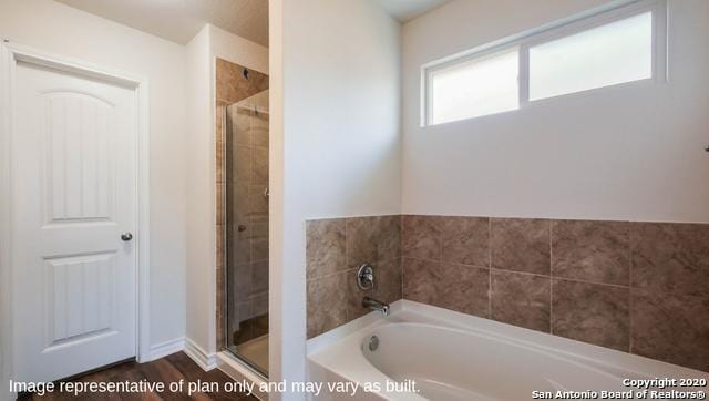 14614 Clay Ridge Run, San Antonio, TX 78253 - bathroom with a stall shower, a bath, and wood finished floors