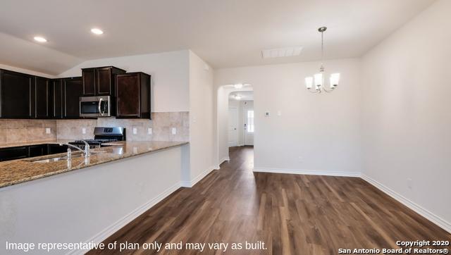 14614 Clay Ridge Run, San Antonio, TX 78253 - kitchen featuring stainless steel appliances, a sink, arched walkways, tasteful backsplash, and recessed lighting