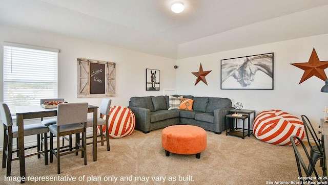 living room with carpet and lofted ceiling