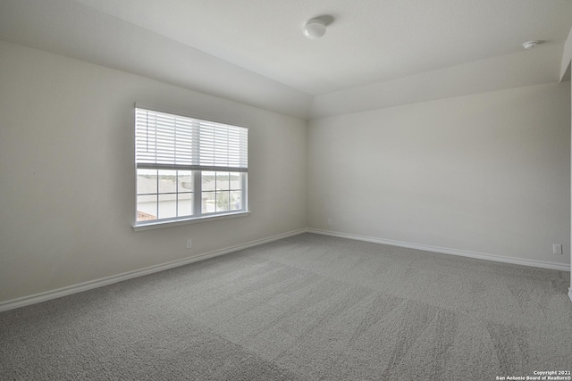 12127 Jasper Strm, San Antonio, TX 78245 - unfurnished room with carpet floors, baseboards, a smoke detector, and vaulted ceiling