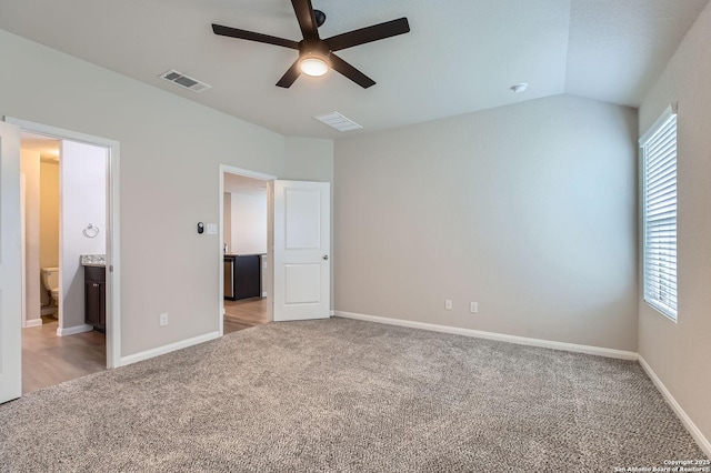 5680 Jasmine Spur, Bulverde, TX 78163 - unfurnished bedroom featuring light carpet, multiple windows, baseboards, and lofted ceiling