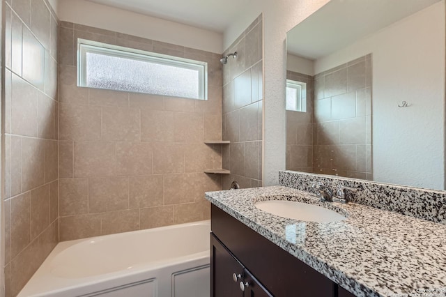 5680 Jasmine Spur, Bulverde, TX 78163 - full bath with vanity, plenty of natural light, and bathtub / shower combination