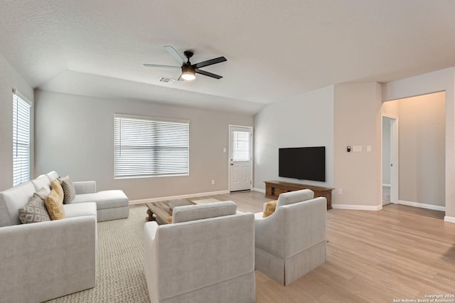 5680 Jasmine Spur, Bulverde, TX 78163 - living area with ceiling fan, light wood-style flooring, and baseboards