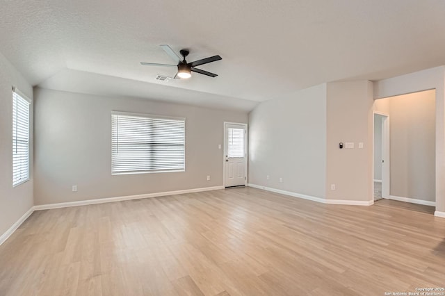 5680 Jasmine Spur, Bulverde, TX 78163 - unfurnished room with ceiling fan, light wood finished floors, baseboards, and vaulted ceiling