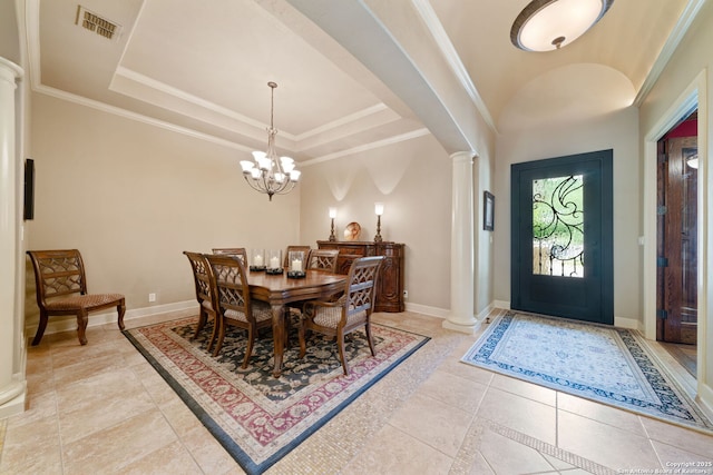 dining space featuring a raised ceiling, visible vents, a chandelier, ornate columns, and light tile patterned floors