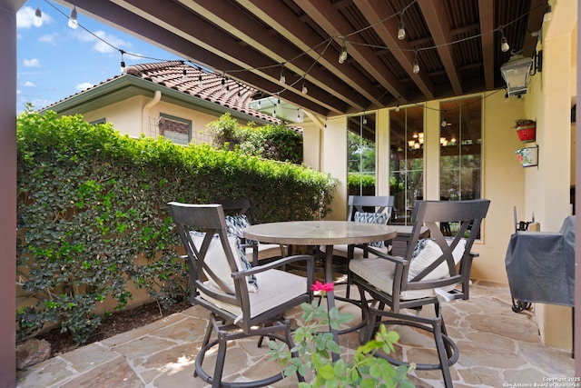 view of patio featuring outdoor dining area