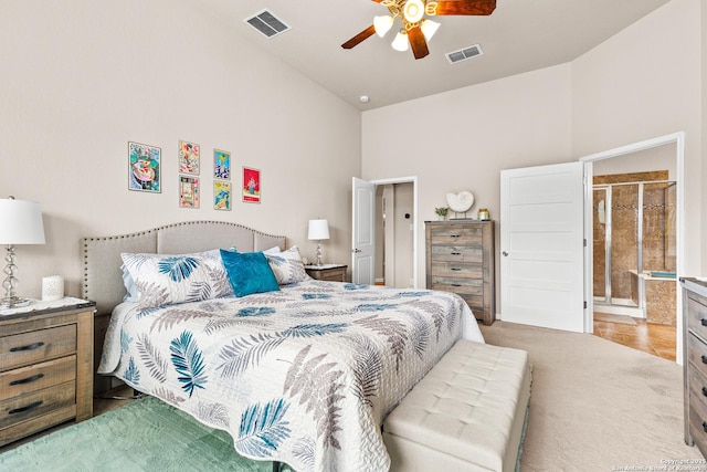 bedroom featuring light carpet, a ceiling fan, visible vents, and high vaulted ceiling