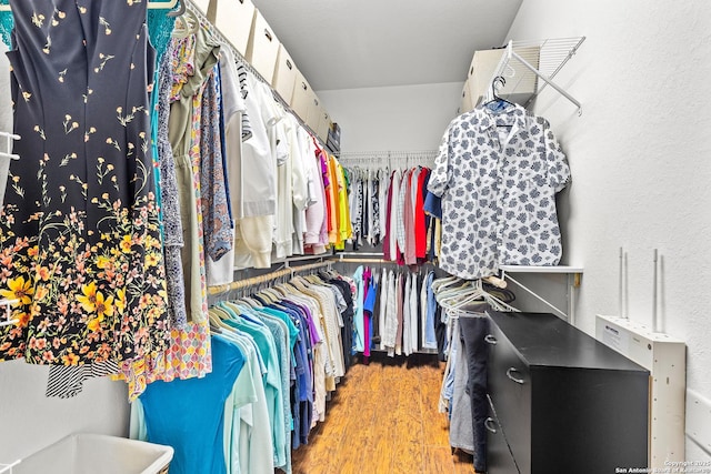 spacious closet with wood finished floors